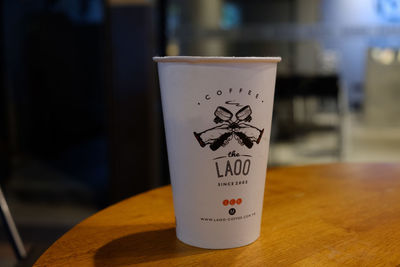 Close-up of coffee cup on table