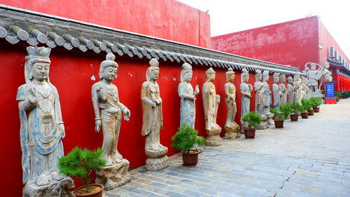 Statue of temple outside building