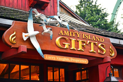 Low angle view of sign against building