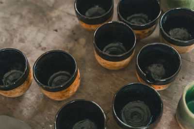 High angle view of cups on table