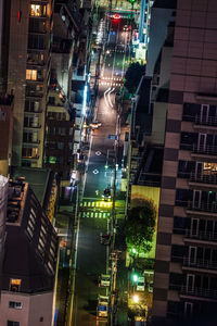 Low angle view of illuminated buildings in city at night