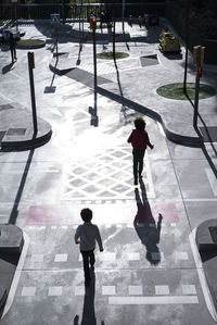 High angle view of people standing in snow