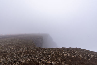 Scenic view of land against sky during winter