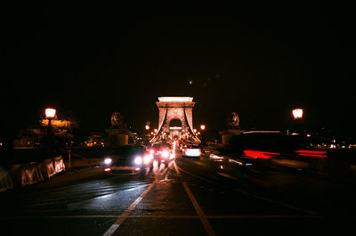 Illuminated suspension bridge at night