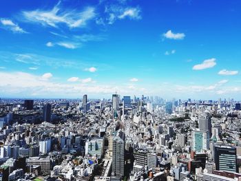 High angle view of modern buildings in city against sky