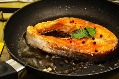 High angle view of meat in frying pan