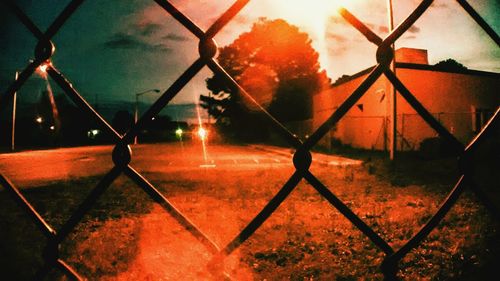 Chainlink fence seen through chainlink fence