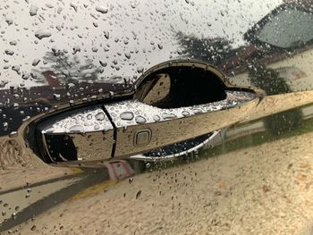 Close-up of rain drops on car window