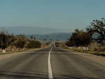 Empty road against clear sky