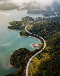 High angle view of road by mountains and sea