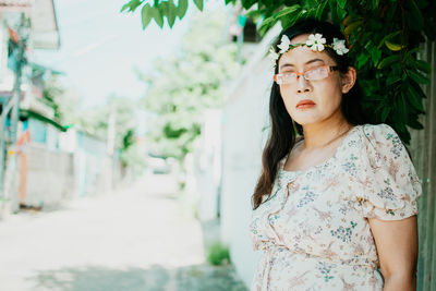 Portrait of a young woman looking away