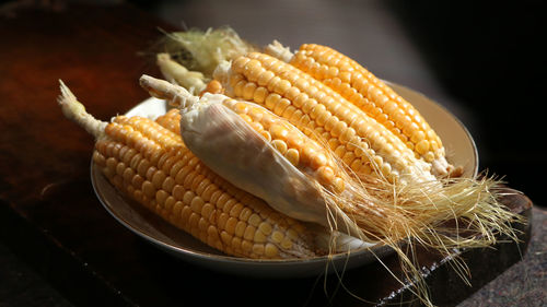 Close-up of corn on table