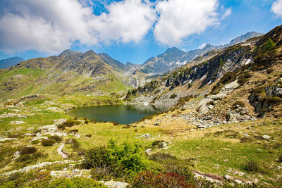 Panoramic view of lake and mountains against sky