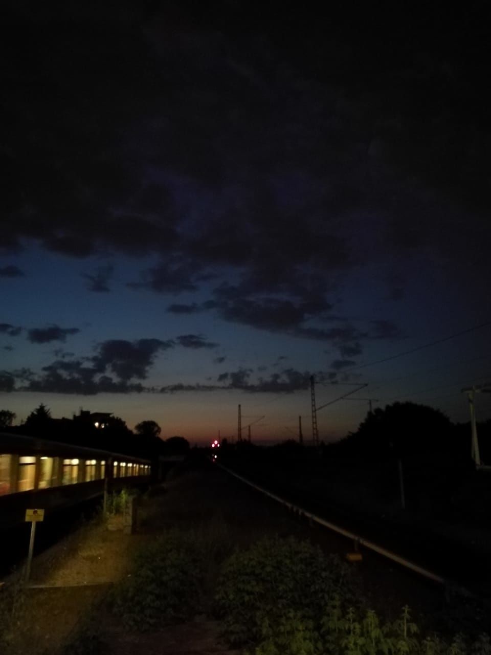 sky, transportation, cloud - sky, nature, direction, no people, plant, the way forward, tree, night, silhouette, beauty in nature, road, dusk, illuminated, environment, sunset, rail transportation, railroad track, architecture, track, outdoors, dark, diminishing perspective