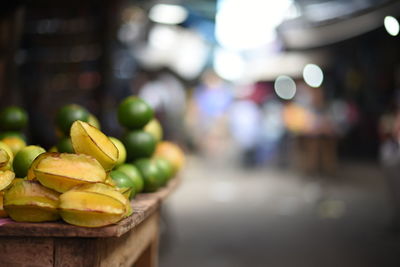 Close-up of fruits on table at market stall