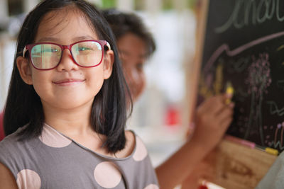 Close-up portrait of smiling girl