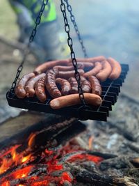 Sausages cooking on barbecue grill
