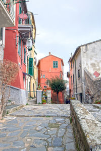 Alley amidst buildings in city