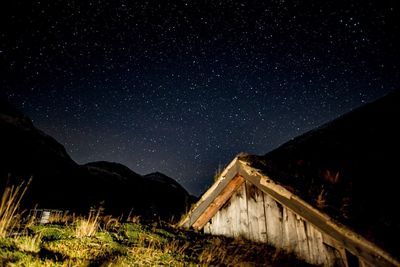 Scenic view of mountain against sky at night