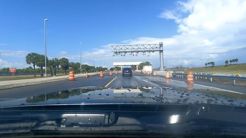 Cars on road against sky