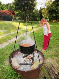 Woman preparing food on grass