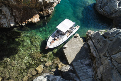 High angle view of rocks by sea