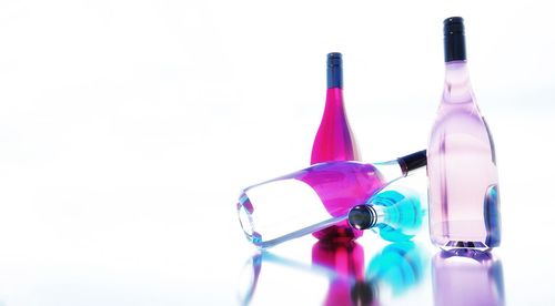 Vodka bottles against white background
