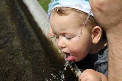 Close-up of wet boy in water