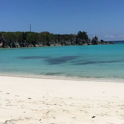 Scenic view of sea against clear blue sky