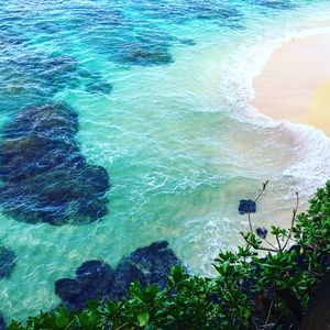 High angle view of rocks at sea shore