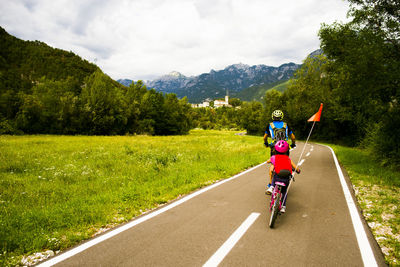 Man riding bicycle on road