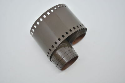 Close-up of camera over white background