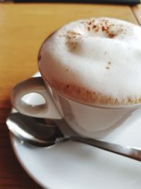 Close-up of cappuccino on table