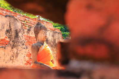 Statue against temple