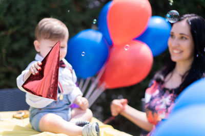 Portrait of woman with balloons