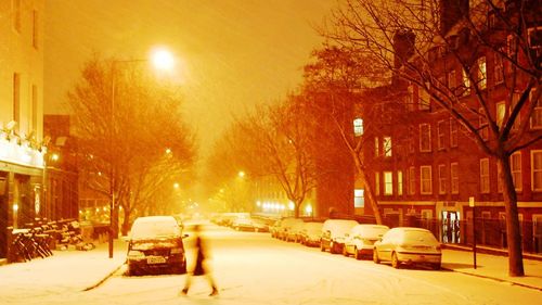 Cars on street in winter at night