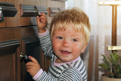 Portrait of smiling boy at home