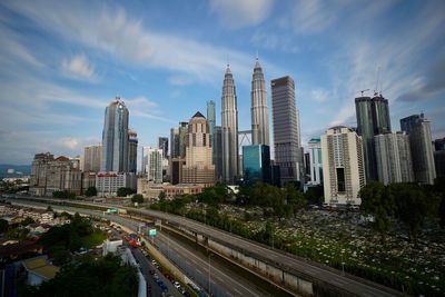 Panoramic view of city buildings against sky