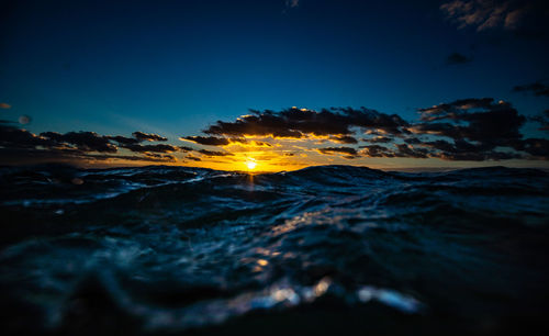 Scenic view of sea against sky at sunset