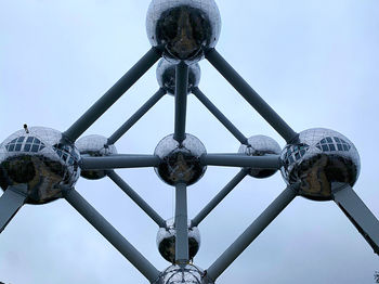 Low angle view of metal structure against sky