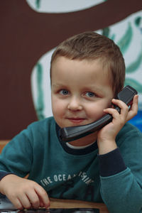 Portrait of cute girl using mobile phone