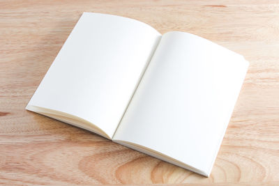 High angle view of open book on table