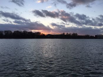 Scenic view of river at sunset