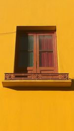 Low angle view of yellow house