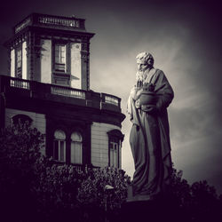 Low angle view of statue against sky