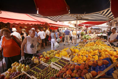 Group of people at market stall