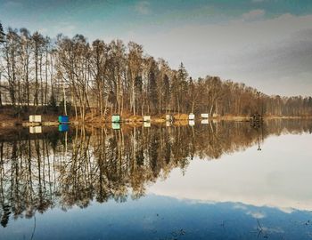 Scenic view of lake against sky during winter