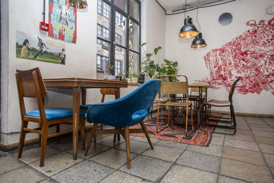 Empty chairs and tables in restaurant