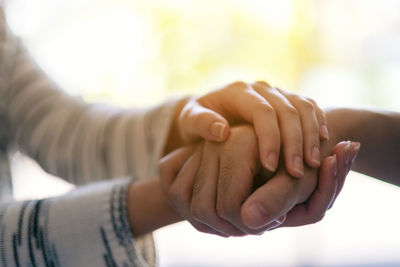 Close-up of woman consoling man