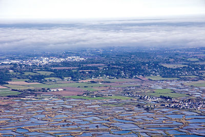 Aerial view of cityscape against sky